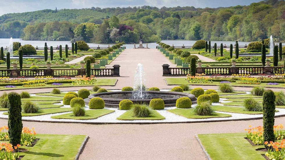 wide shot picture of trentham gardens and a lake in the background