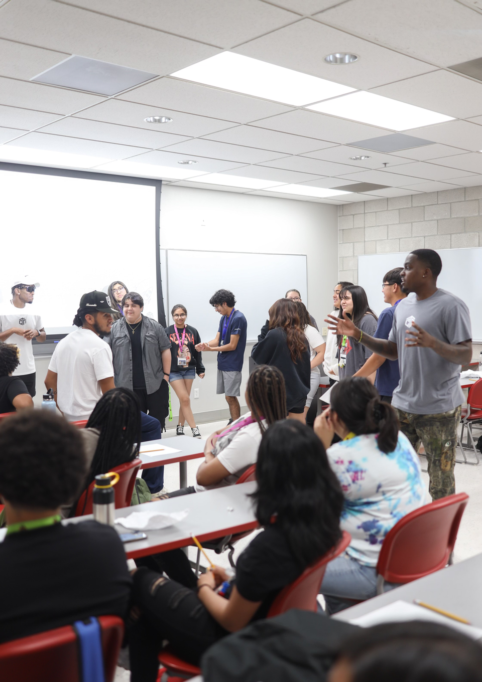 Photo of a Group Activity:
"A diverse group of youth actively participating in a group activity during the Changing the Narrative's Mindset Matters workshop, engaging in teamwork and problem-solving exercises."