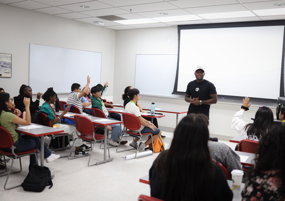 Photo of a Group Activity:
"A diverse group of youth actively participating in a group activity during the Changing the Narrative's Mindset Matters workshop, engaging in teamwork and problem-solving exercises with Malik Hassan."