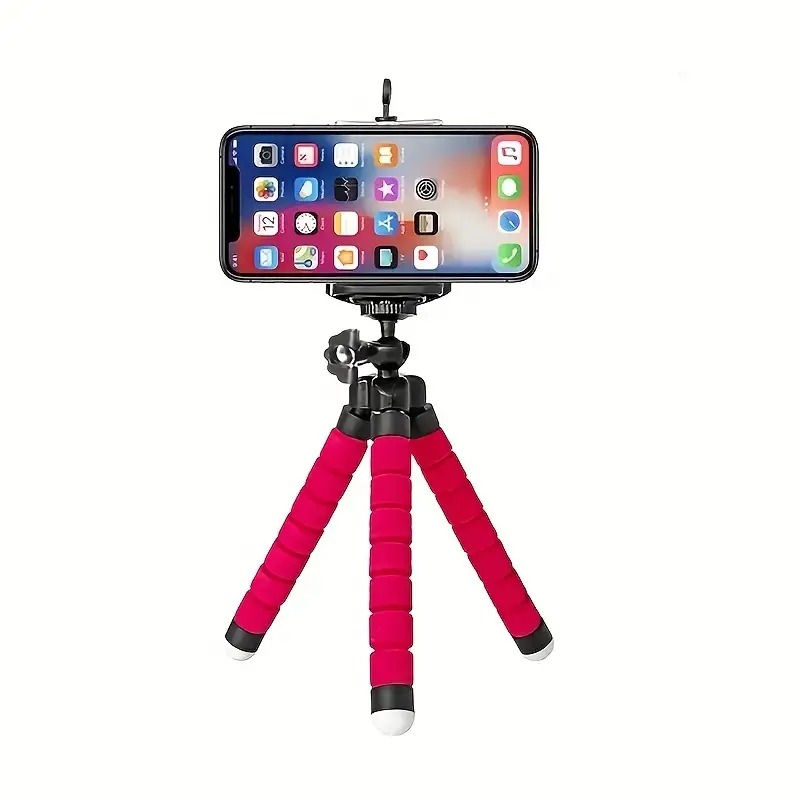 Smartphone mounted on a red mini-tripod