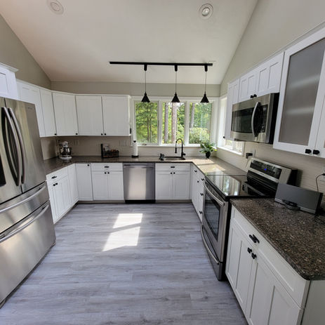 Custom White Kitchen Cabinets, black hardware, stainless steel appliances