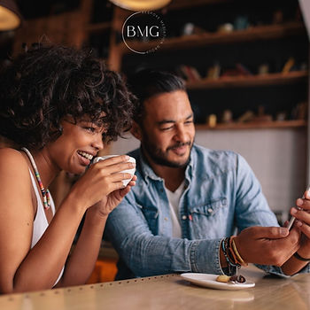 Multicultural couple having coffee at a restaurant.