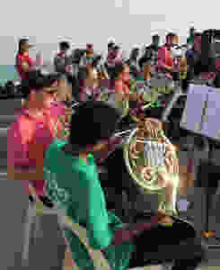 Performing by the sea in Salou, Gower Music Tours