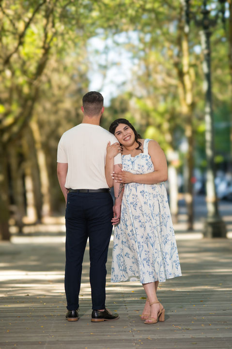 Couple standing together on a tree-lined path, smiling, happy moments captured, Ben Anang