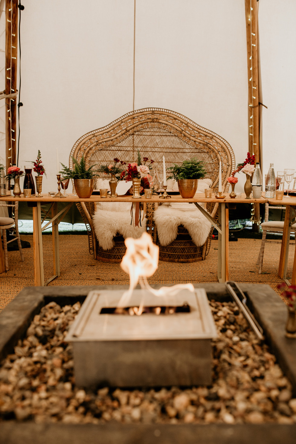 You can choose to have a firepit inside or out!
How about this gorgeous double peacock chair for your top table?