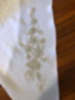 Beaded appliqué on skirt drape