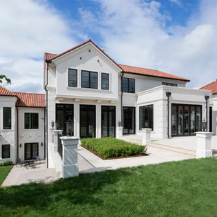 Modern Mediterranean in Medina Minnesota by Owner & Principal Architect at JMAD - James McNeal Architecture & Design. Creative architecture firm specializing in enduring artistry & high-end luxury commercial & residential design. Dream house inspiration, custom homes, mansion, luxurious lifestyle, detailed design. Clay roof, stucco, baroque balconies, elegantly rounded arches. Grand entrance, front door, curb appeal, stunning exterior. Dream backyard, pool house, patio, outdoor living spaces.