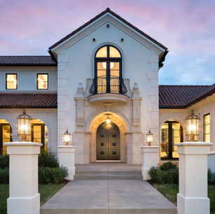 Modern Mediterranean in Medina Minnesota by Jim McNeal, Owner & Principal Architect at JMAD - James McNeal Architecture & Design. Creative architecture firm specializing in enduring artistry & high-end luxury commercial & residential design. Architectural photography, architect portfolio. Dream house inspiration, custom homes, mansion, luxurious lifestyle, detailed design. Red clay roof, white stucco, baroque balconies, elegantly rounded arches. Grand entrance, front door, curb appeal, stunning exterior.