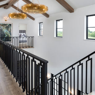 Modern Mediterranean in Medina Minnesota by Owner & Principal Architect at JMAD - James McNeal Architecture & Design. Creative architecture firm specializing in enduring artistry & high-end luxury commercial & residential design. Architect portfolio, detailed design. Dream house inspiration, custom homes, mansion, luxurious lifestyle. Stunning interiors, staircase, custom railing, stairs, stairway, foyer, reading nook, window bench seat. Vaulted ceiling, wood beam ceiling.