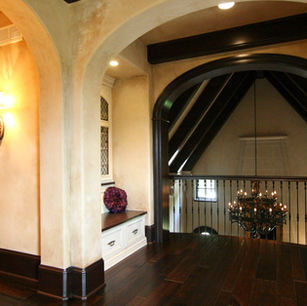 Brick Chateau by James McNeal, Principal Architect at JMAD - James McNeal Architecture & Design. Creative architecture firm specializing in enduring artistry & high-end luxury commercial & residential design. Dream home, luxury house design, custom homes, luxury lifestyle, mansion, boss homes, stunning exterior with curb appeal. Super detailed, artistic, sophisticated, Eclectic chateau style with French Romanesque and islamic arches inside and out, Traditional castle, compartmentalized, brick exterior, Groin vaults, articulated plaster details in the ceilings, Arched entryway stone surround wood beam ceilings home bar, Circular stairs with a landing mid-way that has access to a French balcony