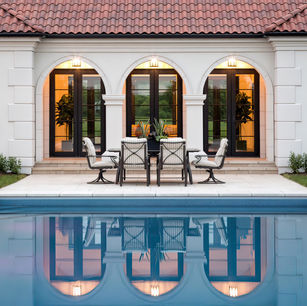 Modern Mediterranean in Medina Minnesota by Owner & Principal Architect at JMAD - James McNeal Architecture & Design. Creative architecture firm specializing in enduring artistry & high-end luxury commercial & residential design. Dream house inspiration, custom homes, mansion, luxurious lifestyle, detailed design. Clay roof, stucco, baroque balconies, elegantly rounded arches. Grand entrance, front door, curb appeal, stunning exterior. Dream backyard, pool house, patio, outdoor living spaces.