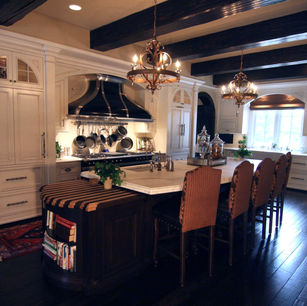 Brick Chateau by James McNeal, Principal Architect at JMAD - James McNeal Architecture & Design. Creative architecture firm specializing in enduring artistry & high-end luxury commercial & residential design. Dream home, luxury house design, custom homes, luxury lifestyle, mansion, boss homes, stunning exterior with curb appeal. Super detailed, artistic, sophisticated, Eclectic chateau style with French Romanesque and islamic arches inside and out, Traditional castle, compartmentalized, brick exterior, Groin vaults, articulated plaster details in the ceilings, Arched entryway stone surround wood beam ceilings home bar, Circular stairs with a landing mid-way that has access to a French balcony wood beam ceiling kitchen custom hood kitchen island custom cabinets