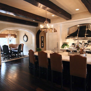 Brick Chateau by James McNeal, Principal Architect at JMAD - James McNeal Architecture & Design. Creative architecture firm specializing in enduring artistry & high-end luxury commercial & residential design. Dream home, luxury house design, custom homes, luxury lifestyle, mansion, boss homes, stunning exterior with curb appeal. Super detailed, artistic, sophisticated, Eclectic chateau style with French Romanesque and islamic arches inside and out, Traditional castle, compartmentalized, brick exterior, Groin vaults, articulated plaster details in the ceilings, Arched entryway stone surround wood beam ceilings home bar, Circular stairs with a landing mid-way that has access to a French balcony wood beam ceiling kitchen custom hood kitchen island custom cabinets