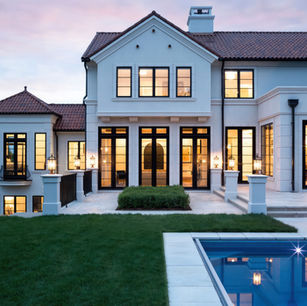 Modern Mediterranean in Medina Minnesota by Owner & Principal Architect at JMAD - James McNeal Architecture & Design. Creative architecture firm specializing in enduring artistry & high-end luxury commercial & residential design. Dream house inspiration, custom homes, mansion, luxurious lifestyle, detailed design. Clay roof, stucco, baroque balconies, elegantly rounded arches. Grand entrance, front door, curb appeal, stunning exterior. Dream backyard, pool house, patio, outdoor living spaces.