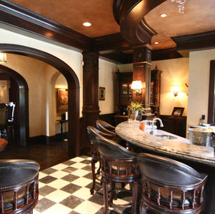 Brick Chateau by James McNeal, Principal Architect at JMAD - James McNeal Architecture & Design. Creative architecture firm specializing in enduring artistry & high-end luxury commercial & residential design. Dream home, luxury house design, custom homes, luxury lifestyle, mansion, boss homes, stunning exterior with curb appeal. Super detailed, artistic, sophisticated, Eclectic chateau style with French Romanesque and islamic arches inside and out, Traditional castle, compartmentalized, brick exterior, Groin vaults, articulated plaster details in the ceilings, Arched entryway stone surround wood beam ceilings home bar, Circular stairs with a landing mid-way that has access to a French balcony wood beam ceiling kitchen custom hood kitchen island custom cabinets fireplace stone surround  living room family room great room home bar