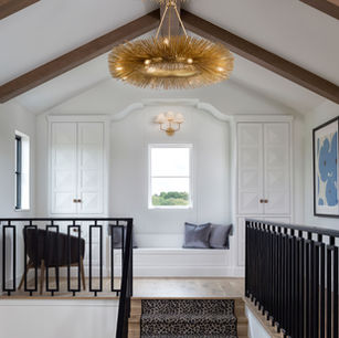 Modern Mediterranean in Medina Minnesota by Owner & Principal Architect at JMAD - James McNeal Architecture & Design. Creative architecture firm specializing in enduring artistry & high-end luxury commercial & residential design. Architect portfolio, detailed design. Dream house inspiration, custom homes, mansion, luxurious lifestyle. Stunning interiors, staircase, custom railing, stairs, stairway, foyer, reading nook, window bench seat. Vaulted ceiling, wood beam ceiling.