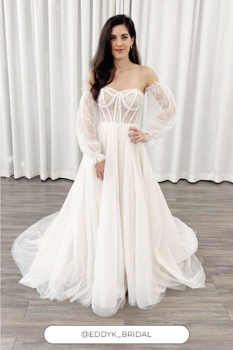 Brown Hair Woman wearing sparkly strapless ballgown with detachable sleeves