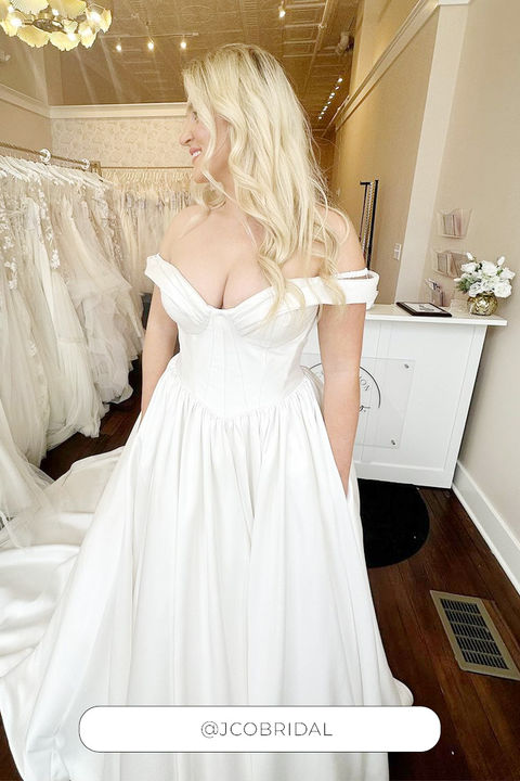 Blonde bride wearing beautiful mikado ballgown.