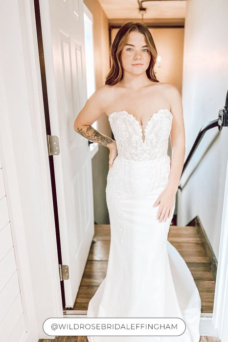 Woman wearing stunning Fit-n-Flare gown with heavily beaded lace and sequins