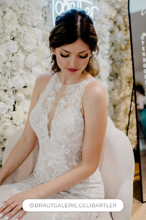 Bride wearing Eddy K mermaid wedding dress with heavy beading and back details