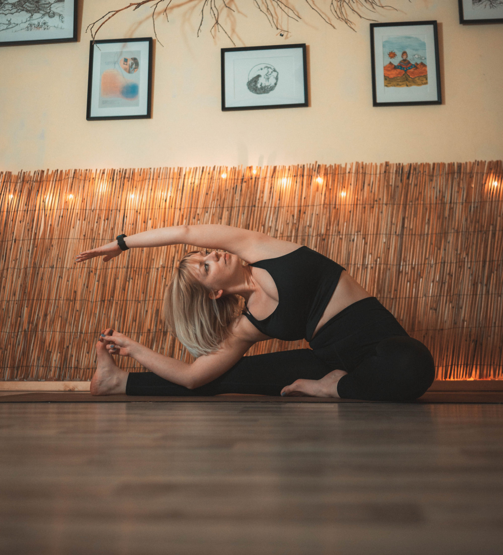 two girls smiling and doing yoga 