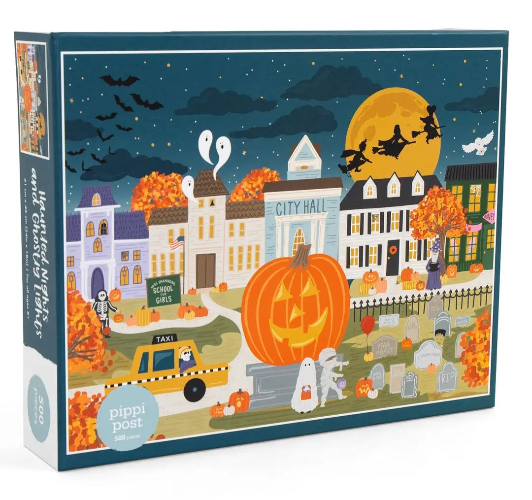 Haunted Night and Ghostly Light jigsaw puzzle showing a crooked haunted house under a moonlit sky with glowing windows