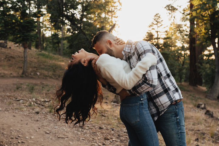 playful engagement photos in the woods on an adventure session with gianna christina photo