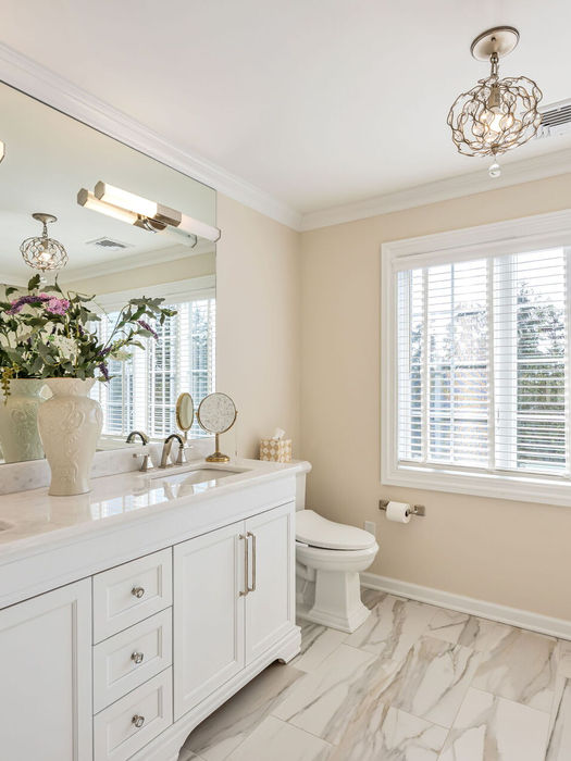 primary bathroom with soaking tub and double vanity at 26 Barrister Court Fair Lawn NJ townhome