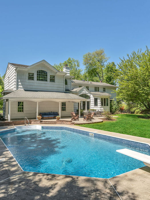 Heated in-ground swimming pool at luxury home in Wyckoff NJ