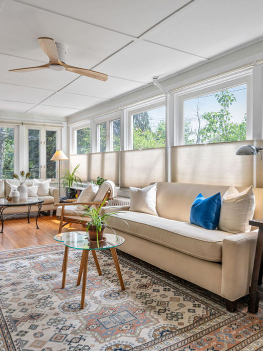 large family room with wall of windows and seating area Franklin Lakes NJ home interior