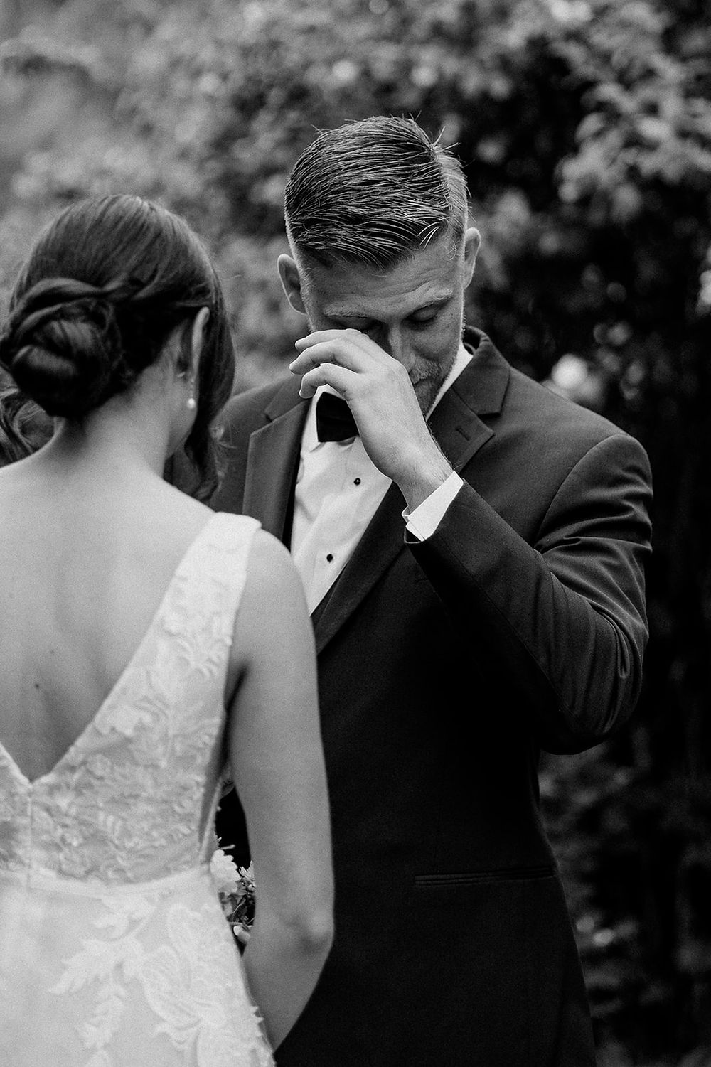 Groom wipes away a tear during private vows at Corvallis, Oregon wedding.