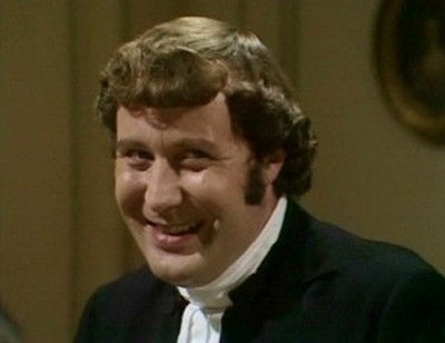 Mr. Collins, smiling (played by Malcolm Rennie)