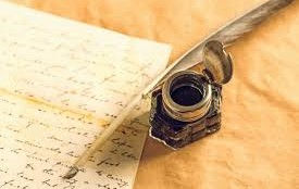 Feather quill, ink, and paper