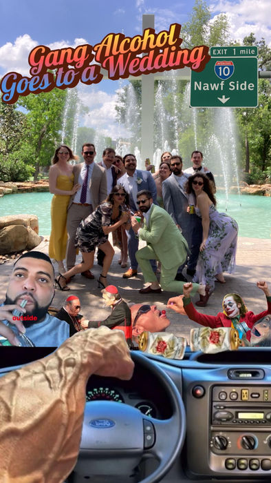 Group of people posing by a fountain with visible text and background.