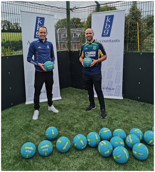Cormac Smith (KBG) presenting 20 new footballs to Gerry Reilly of Ballyhaise U-7