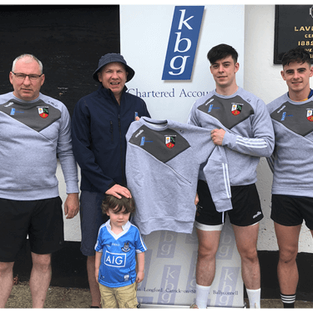 Mark Reilly Presents training tops to Lavey GFC and his colleague Gerard Smith