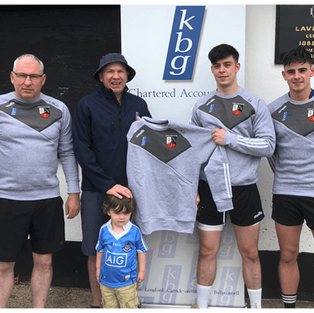 Mark Reilly Presents training tops to Lavey GFC and his colleague Gerard Smith