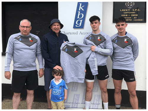 Mark Reilly Presents training tops to Lavey GFC and his colleague Gerard Smith