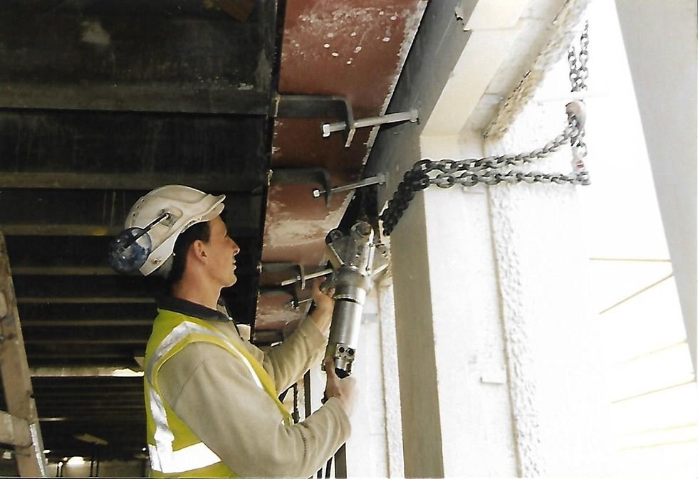 Wall saw removal of precast concrete facade from front of building