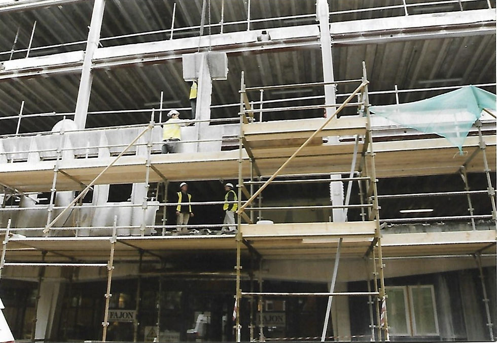 Wall saw removal of precast concrete facade from front of building