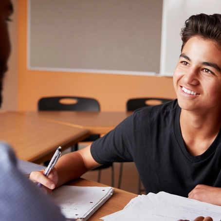 Student working on homework with tutor