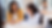 Black woman in yellow sweater helping female student with long dark hair with her homework