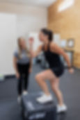 Bryan Kudek guiding patient through exercise at Gaining Grit