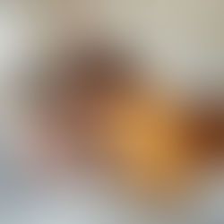 Mother and daughter laying on bed reading together