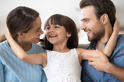 family embracing parents and child.jpg