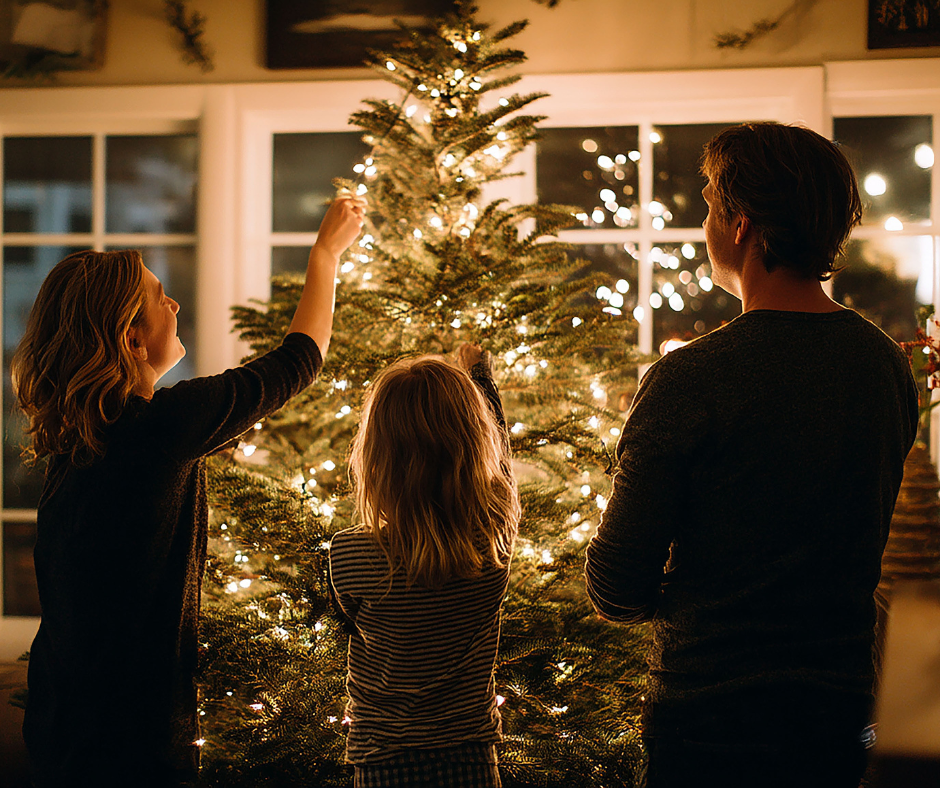 family putting up Christmas tree ornaments, robb's portable buildings