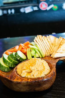 Hummus board, creamy house made hummus complete with fresh veggies and grilled pita bread