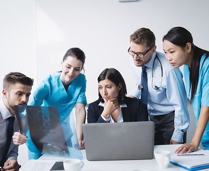 medical-team-examining-x-ray-report.jpg