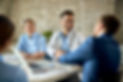 group-healthcare-workers-greeting-financial-advisor-during-meeting-office-focus-is-young-d