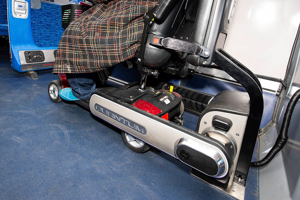 An electric scooter secured on a bus by the QUANTUM system.